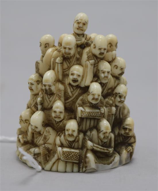 A Japanese ivory netsuke of multiple rakan, Meiji period, height 5.6cm